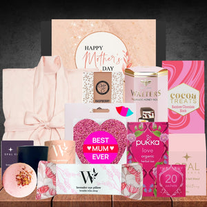 Collection of Mother's Day gifts including a robe, tea, and other items on a dark background