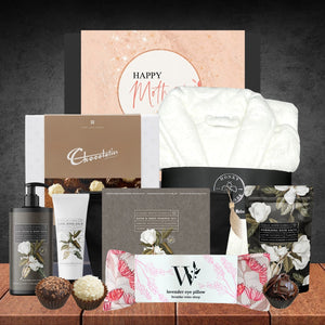 Collection of bath and body products with branded packaging on a wooden surface.