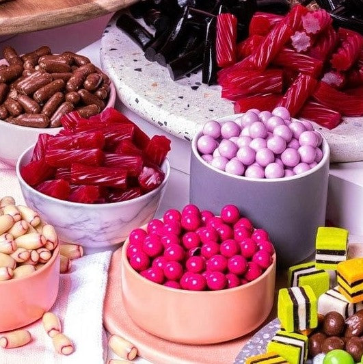 Darrell Lea chocolate coated chewy raspberry milk chocolate balls 160g