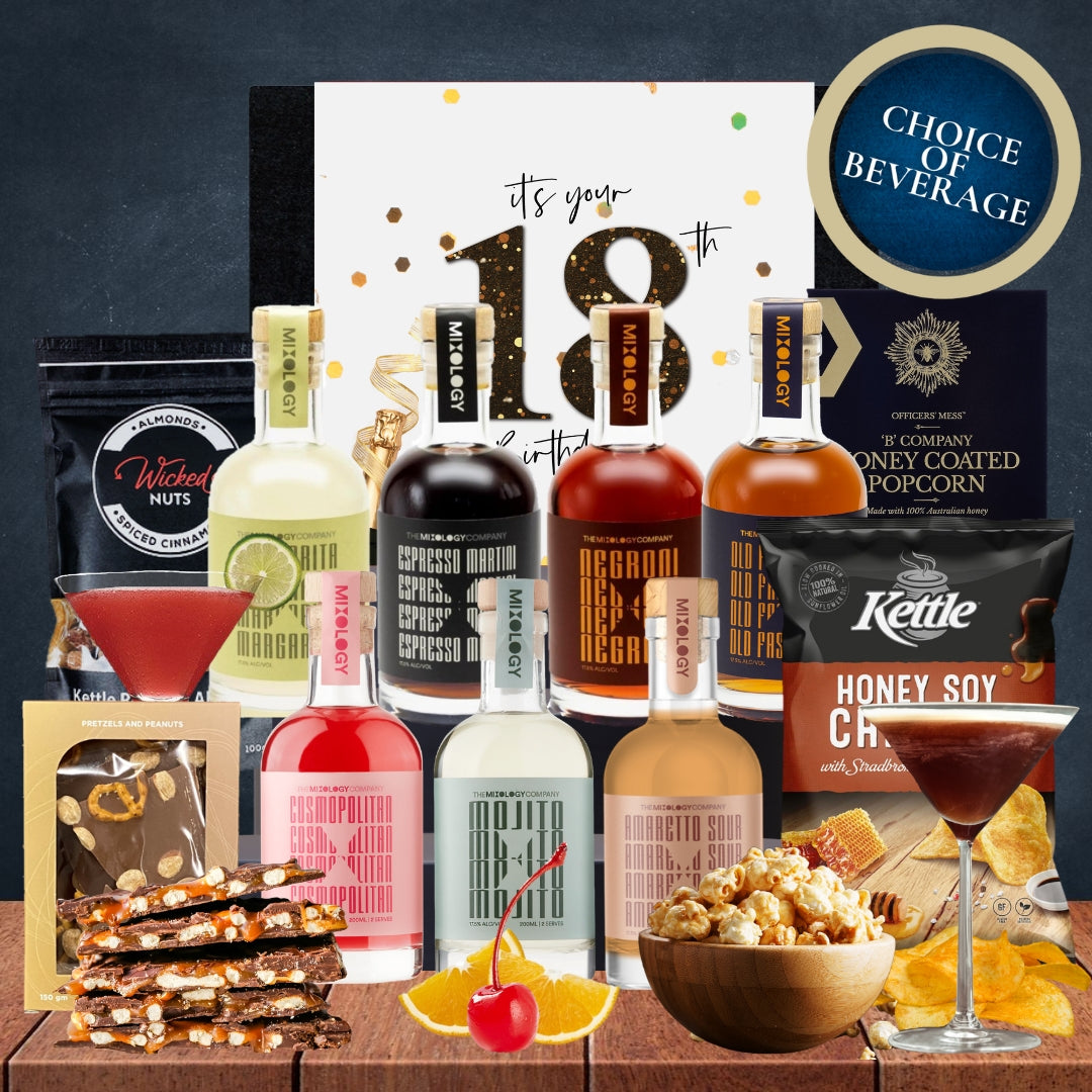 Gourmet gift set with drinks, snacks, and a 'Choice of Beverage' sign on a wooden surface.