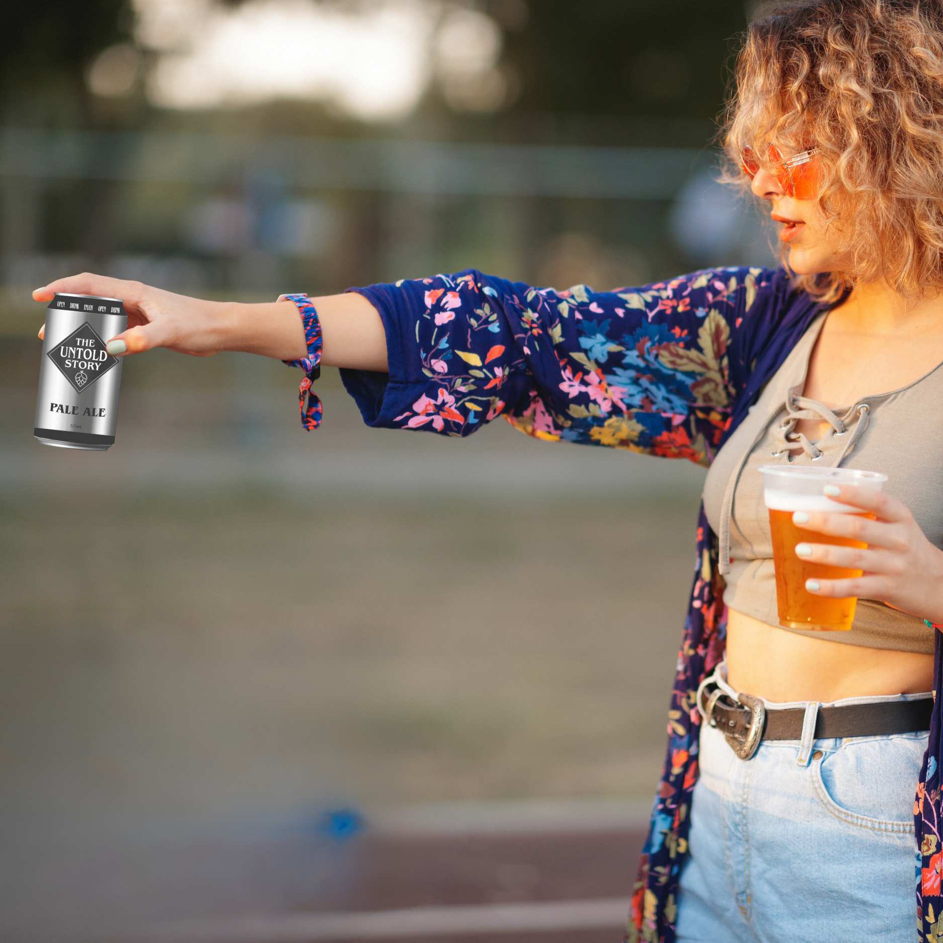 Women hold The Untold Story Australian Lager Beer