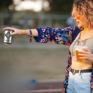 Women hold The Untold Story Australian Lager Beer
